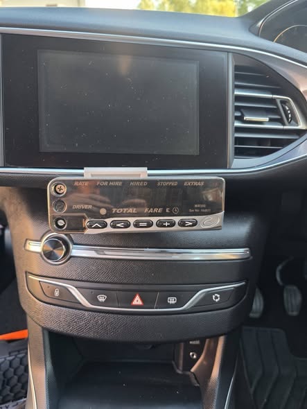 Taxi meter installed using the custom bracket